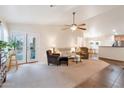 Bright and spacious living room with comfortable seating and a view of the kitchen at 23677 N Desert Dr, Florence, AZ 85132