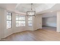 Charming breakfast nook with large windows and a chandelier at 249 E Grandview St, Mesa, AZ 85201