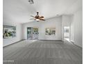 Spacious living area with lots of natural light and neutral tones at 2635 E Desert Wind Dr, Casa Grande, AZ 85194