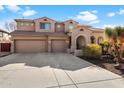 Two-story house with a two-car garage and desert landscaping at 2769 E Cedar Pl, Chandler, AZ 85249