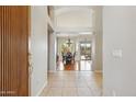 Bright and spacious entryway with tile floors leading to the dining area at 3165 E Indigo Bay Dr, Gilbert, AZ 85234