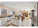 Kitchen with granite countertops, island, stainless steel appliances, and ample cabinet space at 3165 E Indigo Bay Dr, Gilbert, AZ 85234