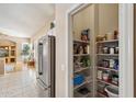 Well-organized pantry with plenty of shelving for storage at 3165 E Indigo Bay Dr, Gilbert, AZ 85234