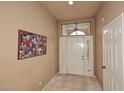 Bright entryway with tile flooring and large artwork at 4015 N 78Th St # 141, Scottsdale, AZ 85251