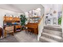 Indoor staircase leading to the upper level, with a view of the kitchen at 4043 W Saguaro Park Ln, Glendale, AZ 85310