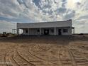 New construction home under construction with covered patio at 48548 W Long Rifle Rd, Aguila, AZ 85320