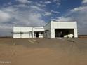 New construction home exterior under construction with a 2-car garage at 48548 W Long Rifle Rd, Aguila, AZ 85320