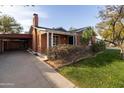 Front view of the house with driveway and carport at 533 W Lewis Ave, Phoenix, AZ 85003