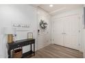 Entryway with console table, wreath, and double doors at 5350 E Deer Valley Dr # 2403, Phoenix, AZ 85054