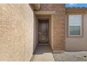 Modern front door entry with brick and stucco exterior at 5429 S 23Rd Dr, Phoenix, AZ 85041