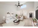 Bright living room with vaulted ceiling, hardwood floors, and a stylish decor at 5711 N 24Th Pl, Phoenix, AZ 85016