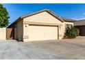 House exterior showcasing a two-car garage and side yard access at 5810 W Puget Ave, Glendale, AZ 85302