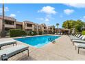 Inviting community pool with lounge chairs and shaded seating area at 5995 N 78Th St # 1015, Scottsdale, AZ 85250