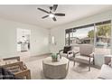 Living room with a view into the kitchen and access to the outdoors at 615 W Enid Ave, Mesa, AZ 85210