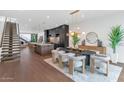 Open concept kitchen and dining area with hardwood floors at 6916 E 2Nd St, Scottsdale, AZ 85251