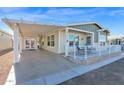 Mobile home with carport and welcoming front porch at 8700 E University Dr # 3505, Mesa, AZ 85207