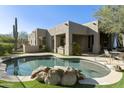 Inviting pool with flagstone patio and mountain views at 9580 E Southwind Ln, Scottsdale, AZ 85262