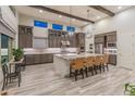 Gourmet kitchen boasts modern cabinetry, granite countertops, and an island at 11842 W Creosote Dr, Peoria, AZ 85383