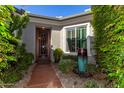 Inviting front entrance with landscaping and a water feature at 1536 W Blaylock Dr, Phoenix, AZ 85085