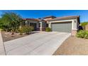 House exterior with a two-car garage and desert landscaping at 1536 W Blaylock Dr, Phoenix, AZ 85085