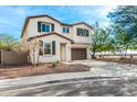 Two-story house with brown garage door and landscaping at 1649 N 212Th Dr, Buckeye, AZ 85396