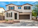 Two-story house with brown garage door and landscaping at 1649 N 212Th Dr, Buckeye, AZ 85396