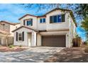 Two-story house with brown garage door and landscaping at 1649 N 212Th Dr, Buckeye, AZ 85396