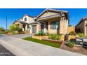 Attractive home with stone and stucco exterior, and a well-manicured front yard at 16611 S 9Th St, Phoenix, AZ 85048