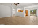 Spacious living room with tile flooring and kitchen views at 19234 W Woodlands Ave, Buckeye, AZ 85326