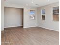 Spacious living room with tile flooring and large windows at 21047 N 58Th Way, Phoenix, AZ 85054