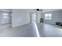 Bright living room with light gray walls and wood-look flooring at 2191 S Descanso Rd, Apache Junction, AZ 85119