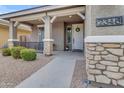 Front porch with stone pillars, white door, and landscaping at 2346 S Banning St, Gilbert, AZ 85295