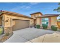 One-story house with a two-car garage and nicely landscaped front yard at 26119 W Wahalla Ln, Buckeye, AZ 85396