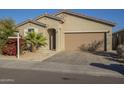 Single story house with tan exterior, attached garage, and landscaping at 2838 W Apollo Rd, Phoenix, AZ 85041