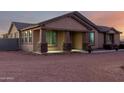 House exterior featuring a covered porch and landscaping at 30964 N Grace Ln, Queen Creek, AZ 85144