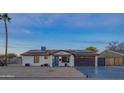 Newly renovated home with solar panels and modern curb appeal at 3402 E Sunnyside Dr, Phoenix, AZ 85028