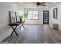 Bright living room with wood-look floors and a modern aesthetic at 3402 E Sunnyside Dr, Phoenix, AZ 85028