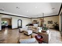 Spacious living room with a neutral color palette, plush seating, and plenty of natural light at 37018 N Tree Lined Trl, Carefree, AZ 85377