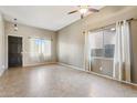 Spacious living room with tile floors and neutral walls at 38213 N Raleigh Way, Anthem, AZ 85086