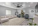 Bright and airy living room with a comfy sectional sofa and a Christmas tree at 4229 N 32Nd Ave, Phoenix, AZ 85017