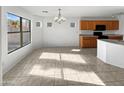 Combined kitchen and dining area with lots of natural light at 4421 W Pleasant Ln, Laveen, AZ 85339