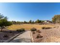 Community park with grassy areas and walking paths at 5496 S 237Th Ln, Buckeye, AZ 85326