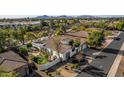 Wide aerial view of the house and surrounding neighborhood at 8951 E Wethersfield Rd, Scottsdale, AZ 85260