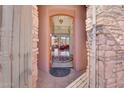 Elegant entry with arched doorway and stonework at 9624 N Copper Ridge Trl, Fountain Hills, AZ 85268