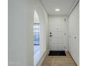 Light and airy entryway with white door and hardwood floors at 10410 N Cave Creek Rd # 1220, Phoenix, AZ 85020