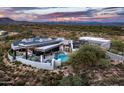 Modern home with solar panels and desert landscaping at 11541 E Salero Dr, Scottsdale, AZ 85262