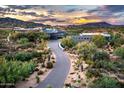 Long paved driveway leading to modern home in desert setting at 11541 E Salero Dr, Scottsdale, AZ 85262