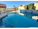 Inviting backyard pool with waterfall feature at 16370 W Adams St, Goodyear, AZ 85338