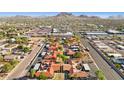 Aerial view of a community with multiple buildings, landscaping, and a pool at 17243 N 16Th St # 1, Phoenix, AZ 85022