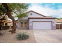 One story house with a two car garage and desert landscaping at 2304 S Abbey --, Mesa, AZ 85209